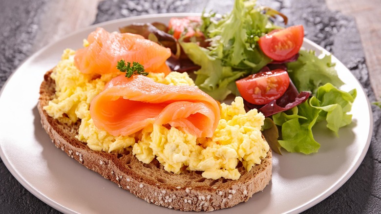 Scrambled eggs on toast with salmon