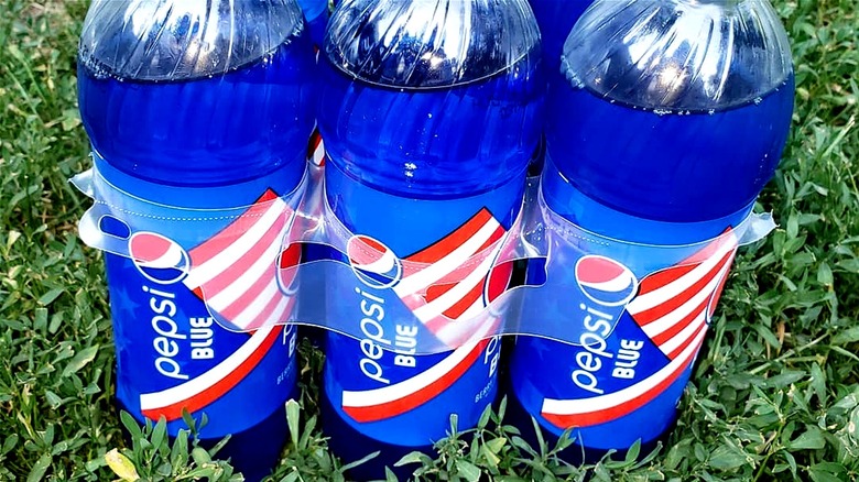 Bottles of Pepsi Blue with a grass background