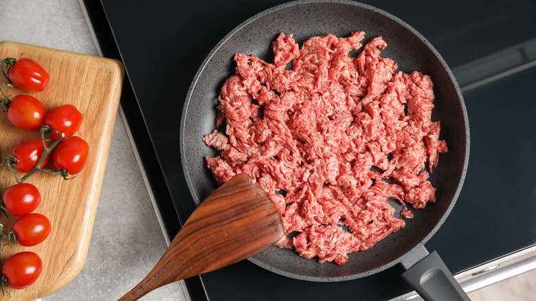 raw ground meat in skillet