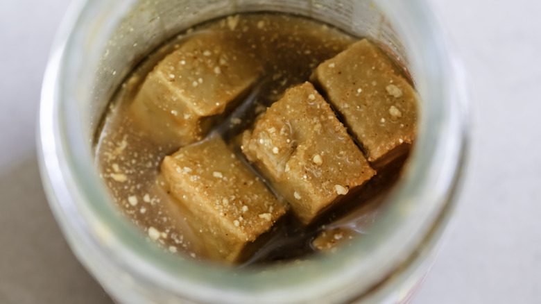 Amber colored cubes of tofu