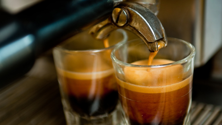 A coffee machine pouring espresso