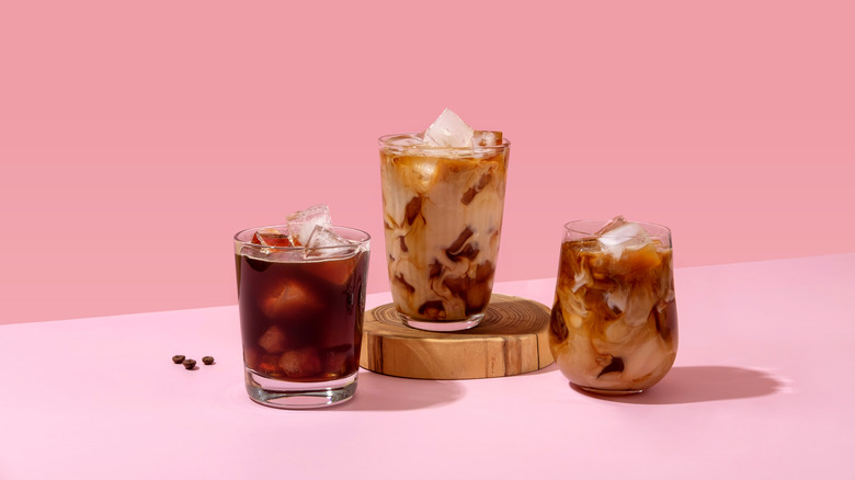Three iced coffees in glasses