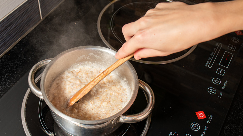 stirring oatmeal in pot