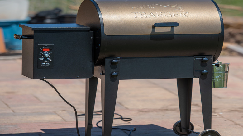 A traeger pellet grill on a patio