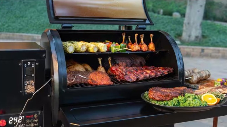 Meat and veggies cooking on a Nexgrill pellet grill