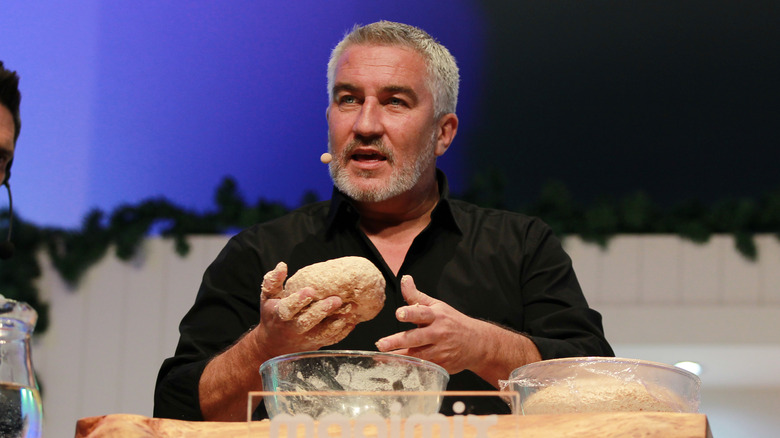 Paul Hollywood holding dough