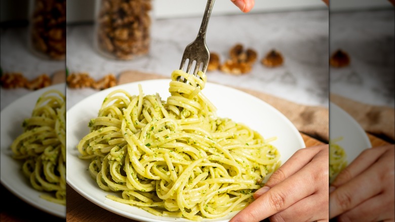 twirling pesto pasta with fork