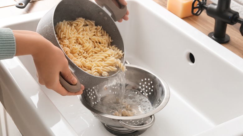 pasta water being poured out