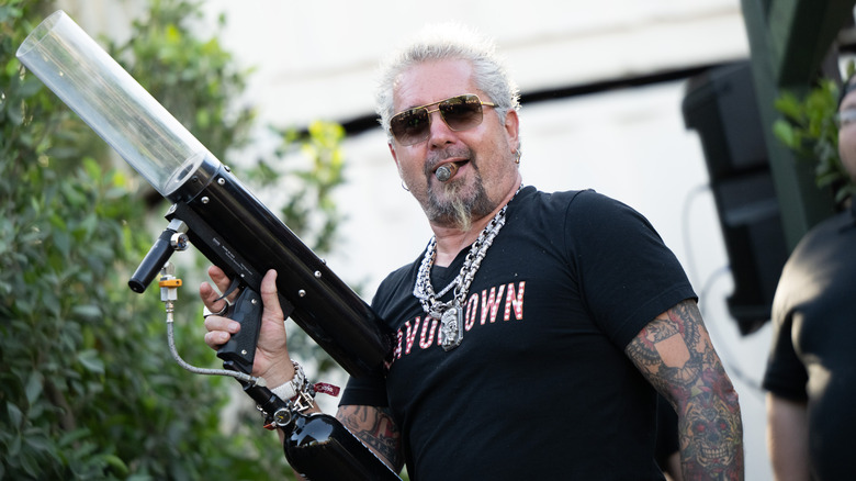 Guy Fieri with a t-shirt gun