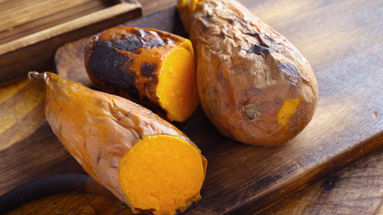 cooked sweet potatoes on cutting board