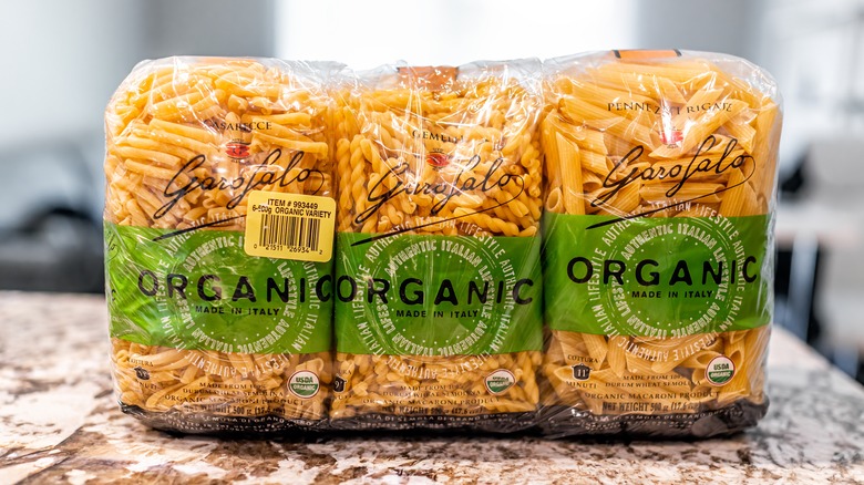 three packages of pasta noodles from Costco