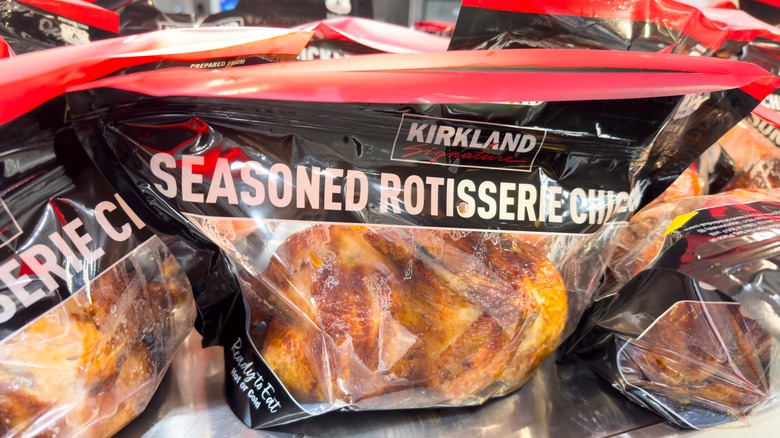 Bags of rotisserie chickens in a row at Costco