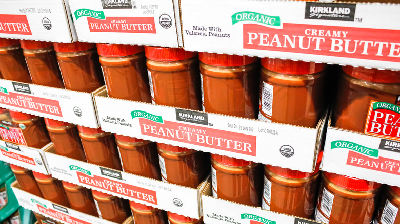 stacks of kirkland peanut butter jars at Costco