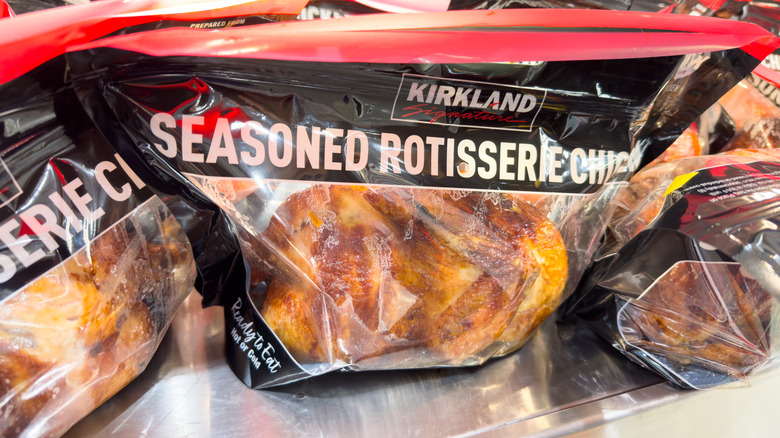 Bags of rotisserie chickens in a row at Costco