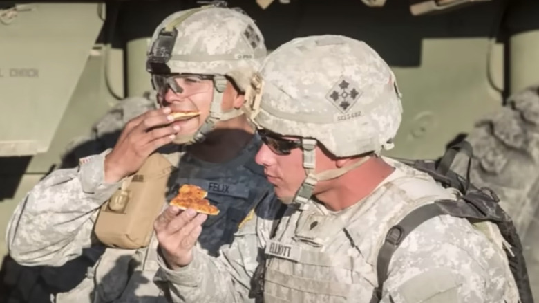 US Soldiers eating pizza MRE's