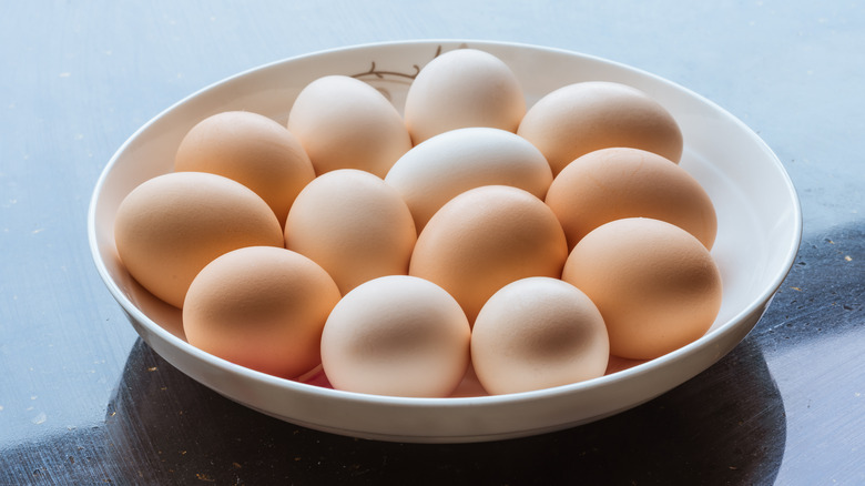 13 eggs in a low-rimmed bowl