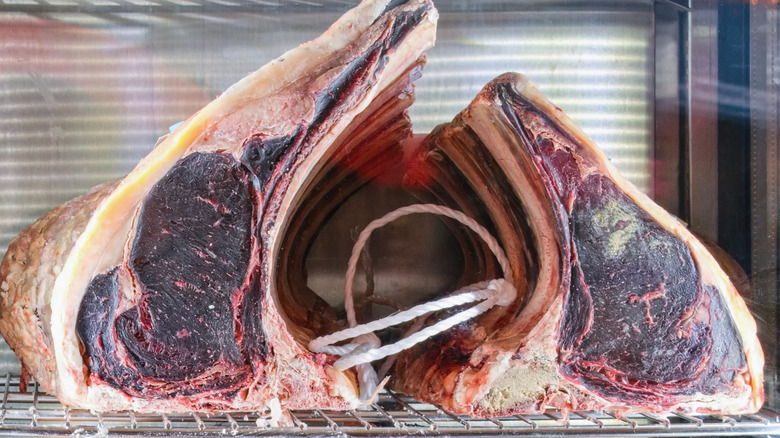 dry aged steaks in a butcher's window