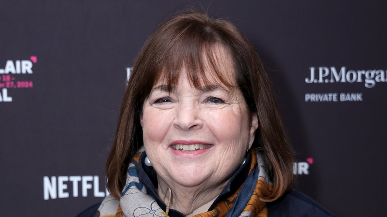 Ina Garten smiling and wearing a blue and orange scarf