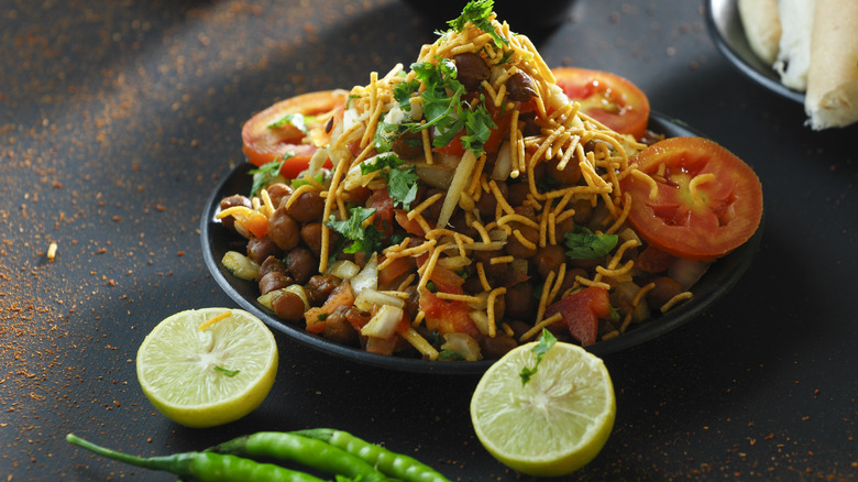 A plate of chaat with tomato slices