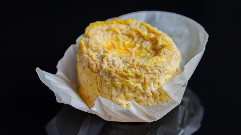 A Langres cheese in paper