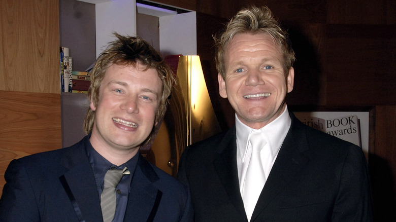 Chefs Jamie Oliver and Gordon Ramsay standing side by side