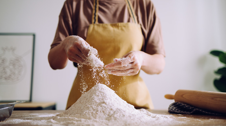 Hands working with pastry flour