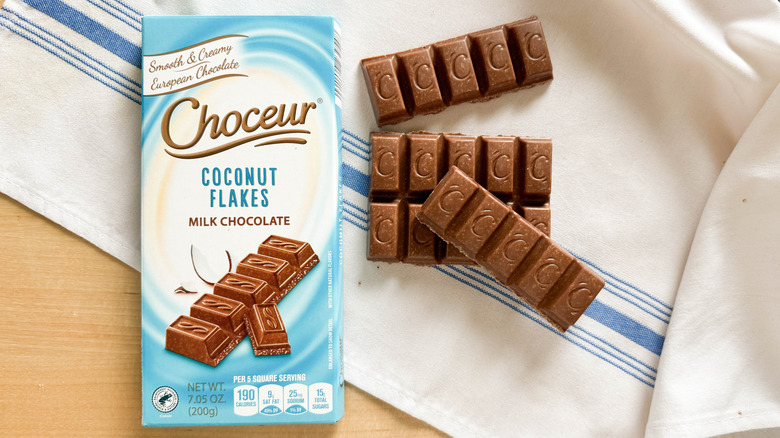 Choceur Coconut Flakes Milk Chocolate bar with packaging on table