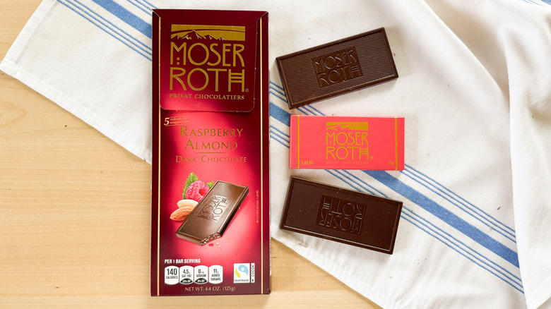 Moser Roth Raspberry Almond Dark Chocolate with wrapper on table