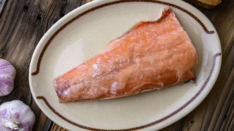 frozen salmon filet on plate