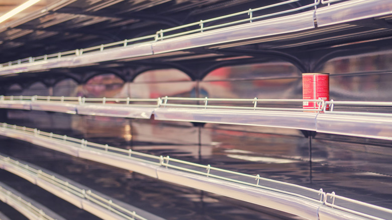 empty supermarket shelves with can