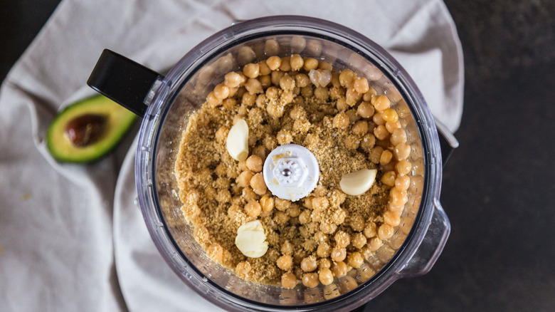 hummus in a blender with whole chickpeas