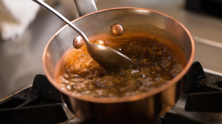 Bubbling caramel in a copper pan
