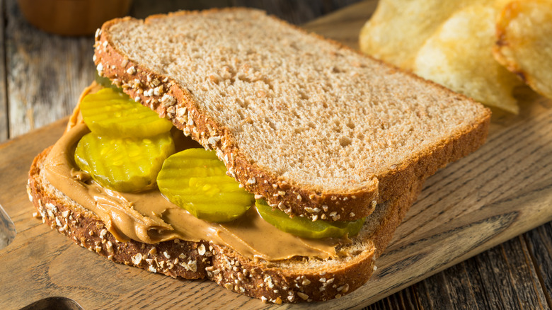 peanut butter and pickle sandwich with chips