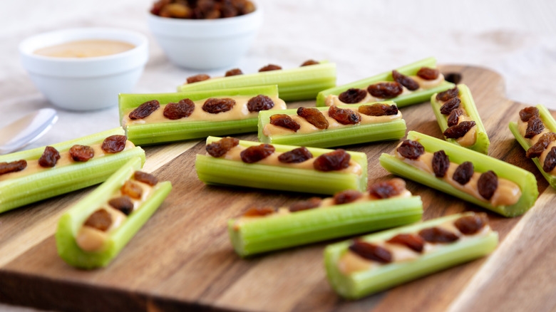 ants on a log snack on cutting board