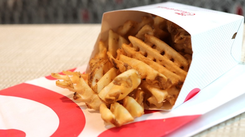 A box of Chick-fil-A waffle fries on a table