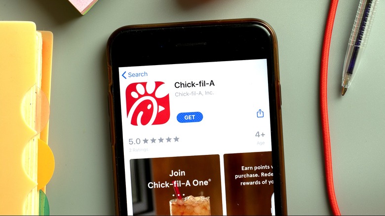 A phone with Chick-fil-A app displayed