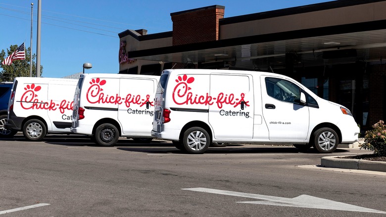 Chick-fil-A catering trucks parked outside a store