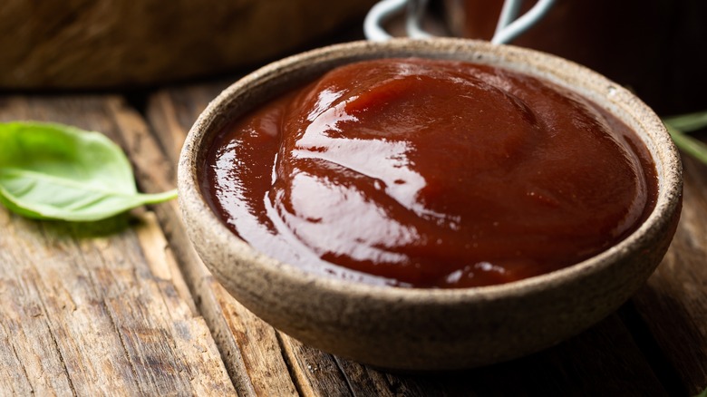 bbq sauce in wooden bowl