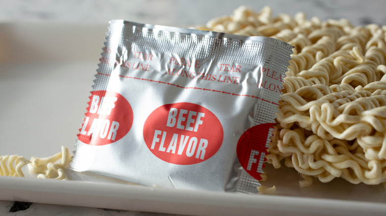 A beef flavor ramen seasoning packet and noodles