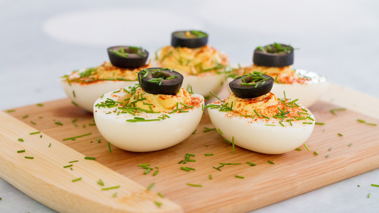 Deviled eggs garnished with olives