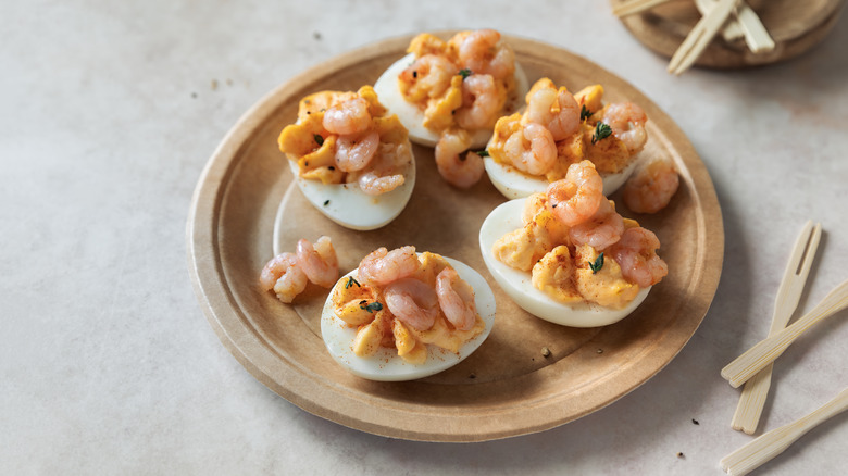 Deviled eggs topped with prawns