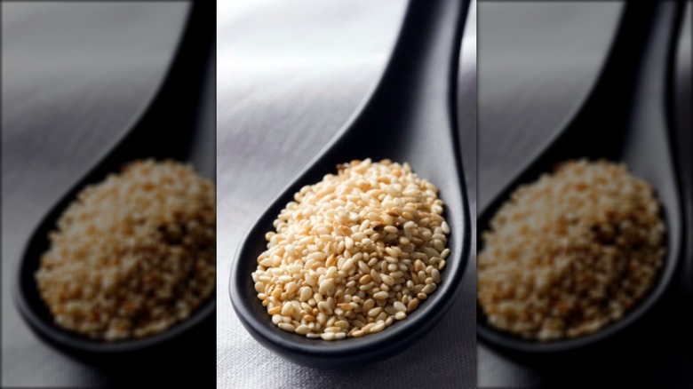 A spoon full of sesame seeds