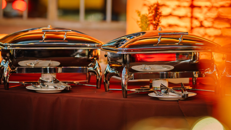 Two chafing dishes on a table