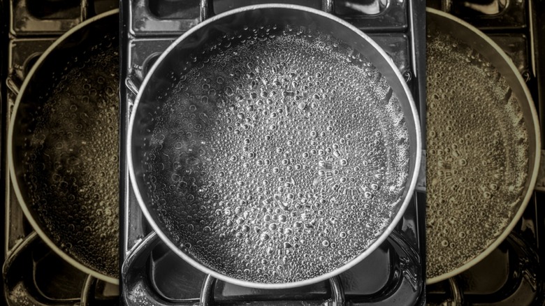 Shallow pan of boiling water