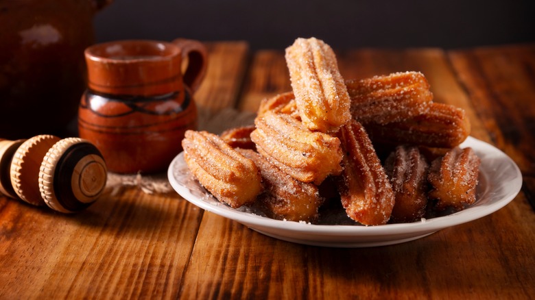 A plate of sugared churros