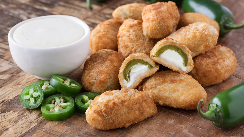 Battered jalapeno poppers with sour cream
