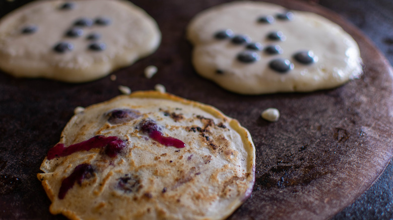 blueberry pancakes on skillet