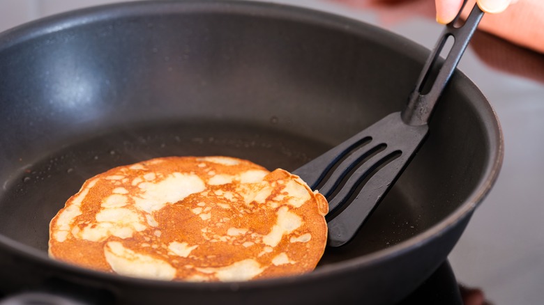 flipping pancake with spatula