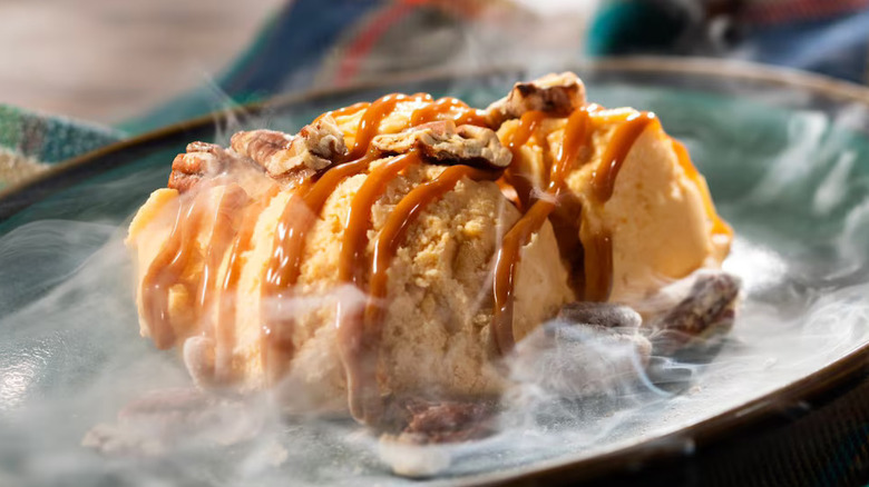 Plate of dessert with pecans and caramel sauce