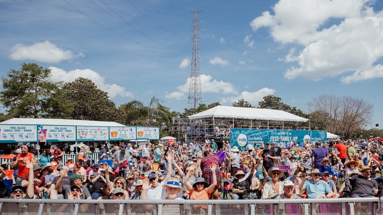 Crowd of people at French Quarter Food Festival on a sunny day.